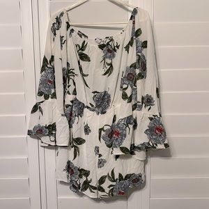 NWOT Fashion Nova flowy, off-the-shoulder flowered romper. Size XL.